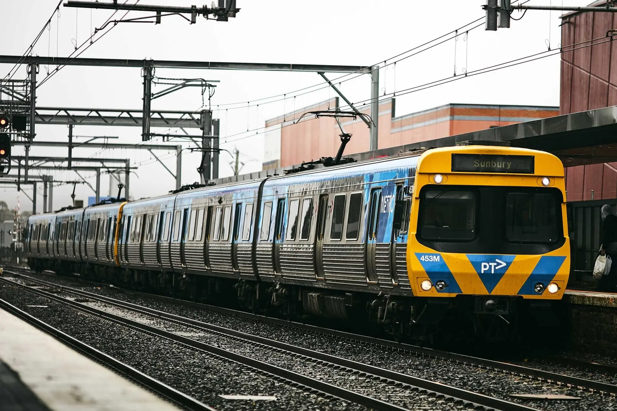 A yellow and blue Metro train, displaying